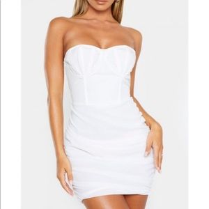 Pretty little thing white cup top strapless dress.